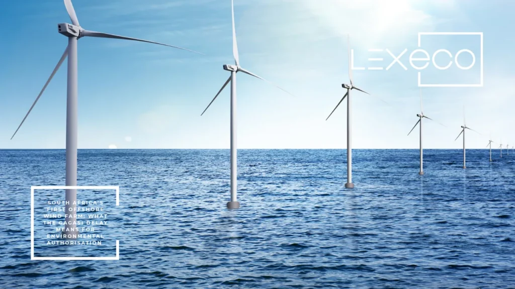 Offshore wind turbines in a row at sea under a blue sky